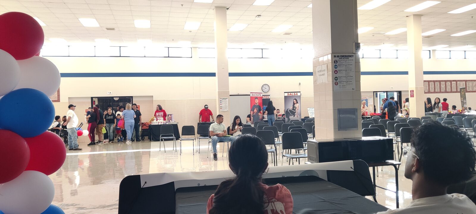 Families gathered in the hall at a South Garland Early College community event.